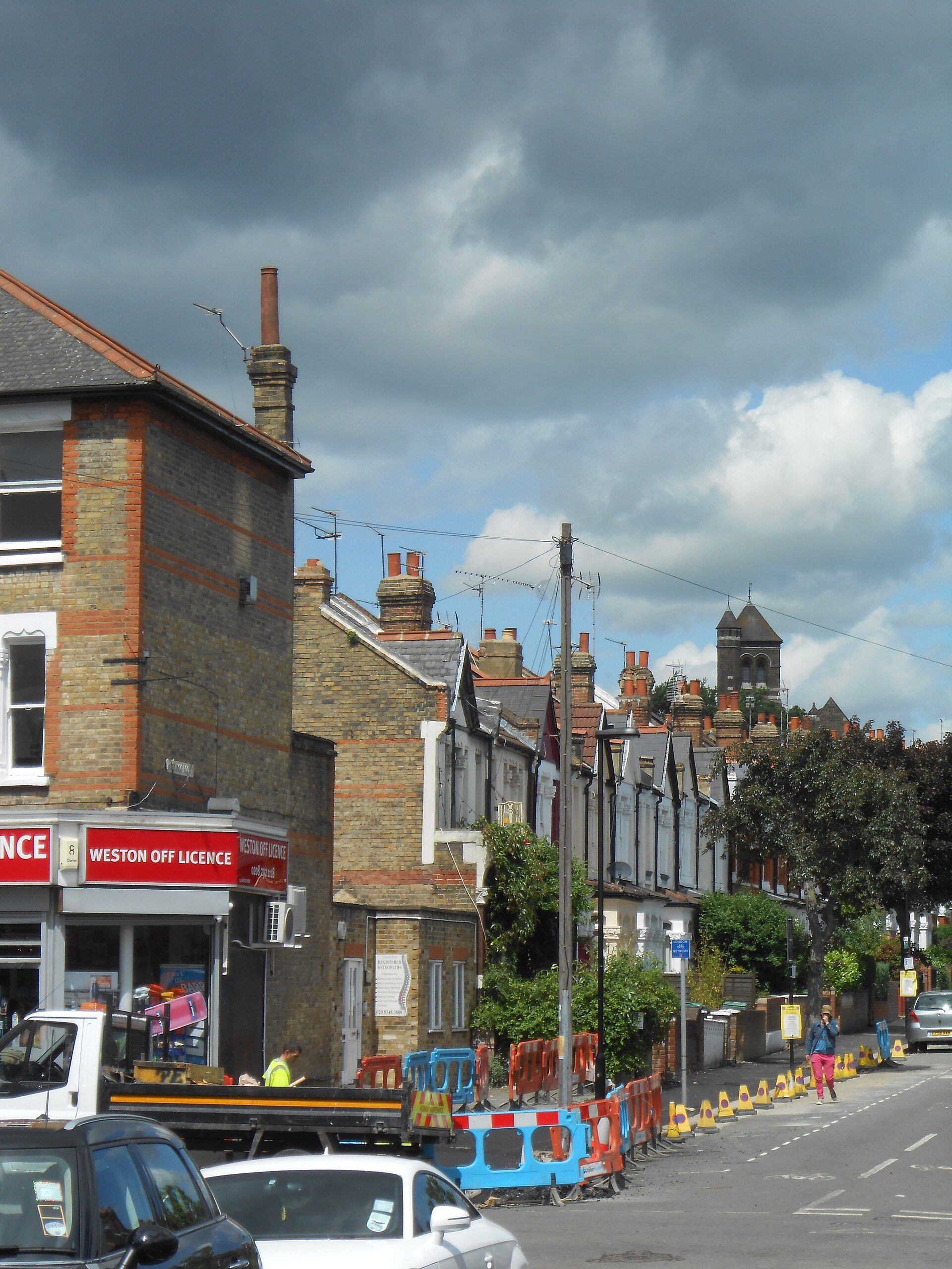 Inderwick Road, Crouch End, pictured during roadworks near the row of shops and terraced houses.