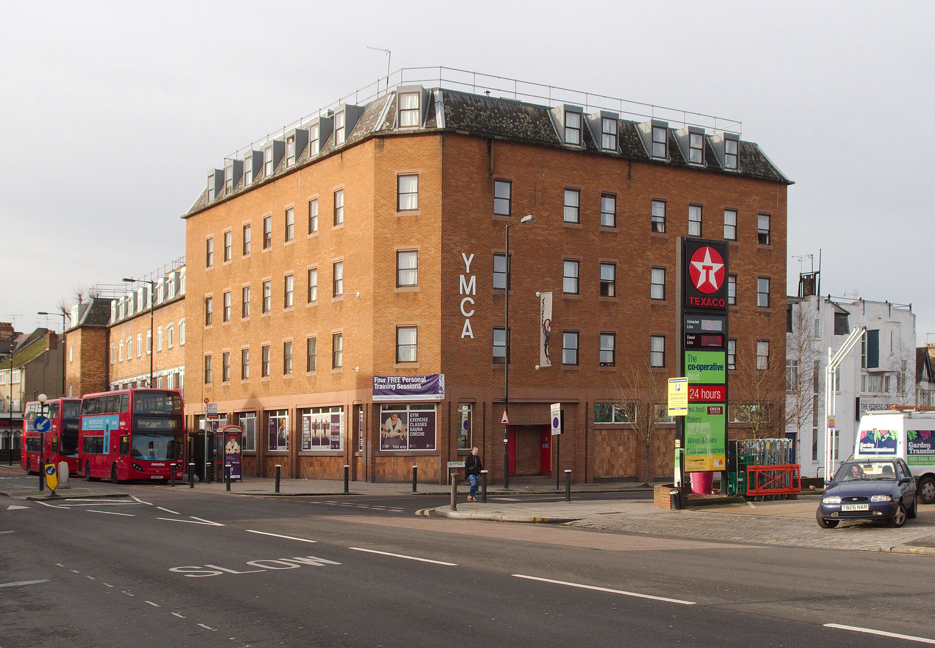 YMCA building on Tottenham Lane, Crouch End, with a London bus passing, affected by the burst water main diversion.